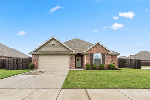 view of front facade with a garage and a front lawn