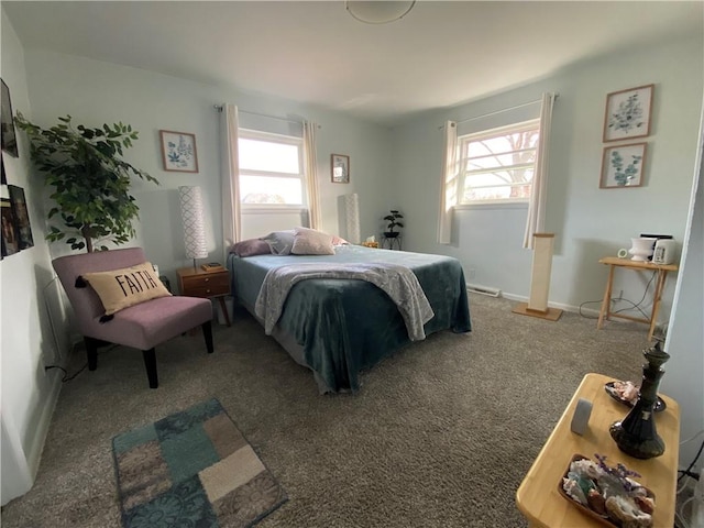 bedroom featuring multiple windows and dark carpet