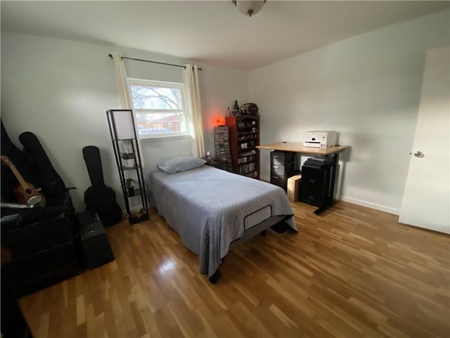 bedroom featuring hardwood / wood-style floors