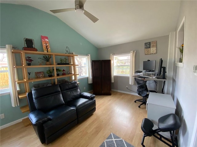 office space with lofted ceiling, light hardwood / wood-style floors, and ceiling fan