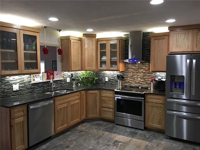 kitchen with stainless steel appliances, sink, decorative backsplash, and wall chimney exhaust hood