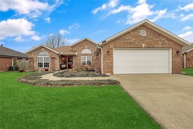 view of front of house featuring central AC, a garage, and a front yard