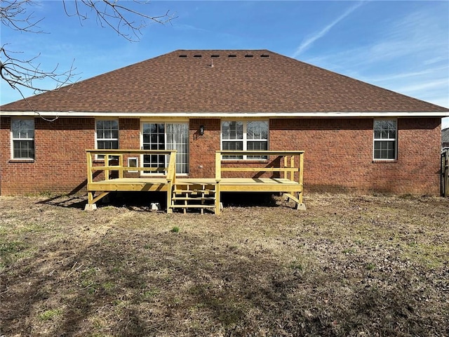 back of house featuring a deck