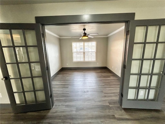 interior space featuring crown molding, ceiling fan, and dark hardwood / wood-style floors