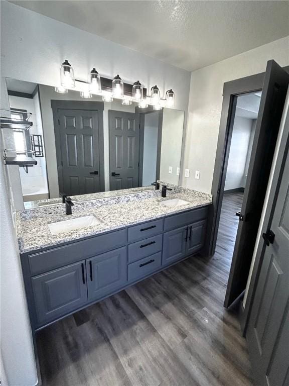 bathroom featuring vanity and hardwood / wood-style floors