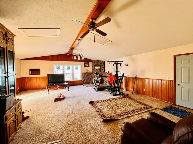 workout area with lofted ceiling, carpet flooring, and wood walls