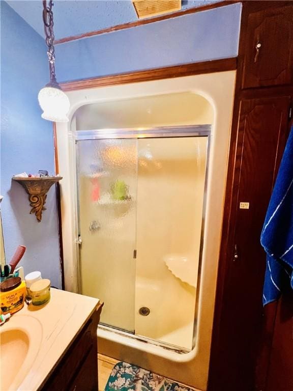 bathroom with vanity and an enclosed shower