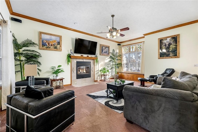 living room featuring crown molding, carpet, ceiling fan, and a textured ceiling