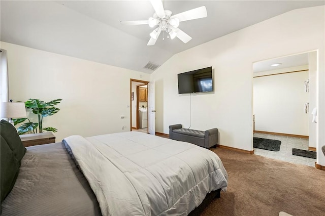 carpeted bedroom featuring washer / dryer, vaulted ceiling, and ceiling fan