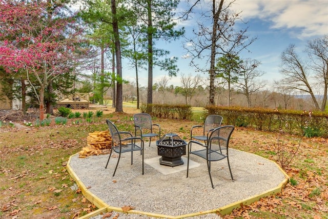 view of patio / terrace with an outdoor fire pit