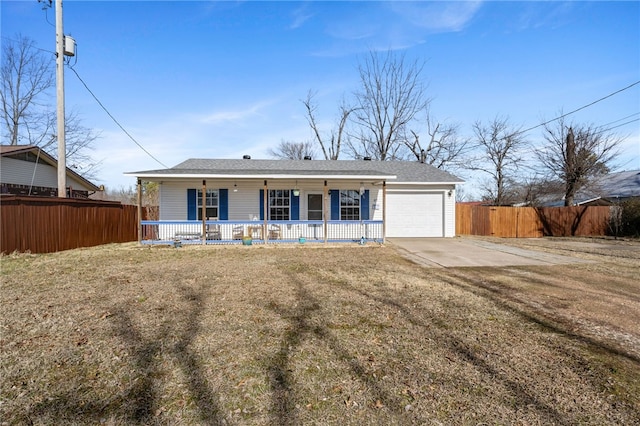 view of front of home featuring a garage, covered porch, and a front lawn