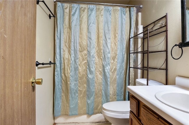 bathroom with vanity, walk in shower, and toilet