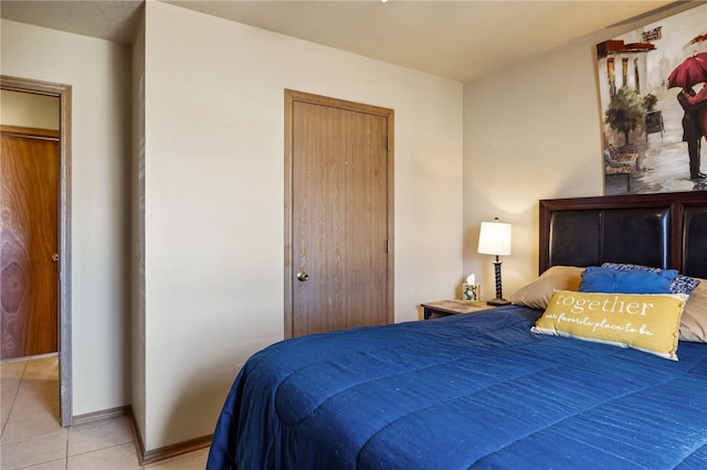 bedroom featuring light tile patterned floors