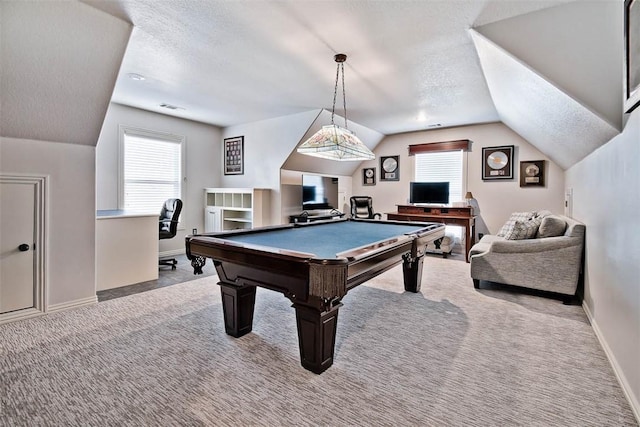 game room with vaulted ceiling, light colored carpet, a textured ceiling, and billiards