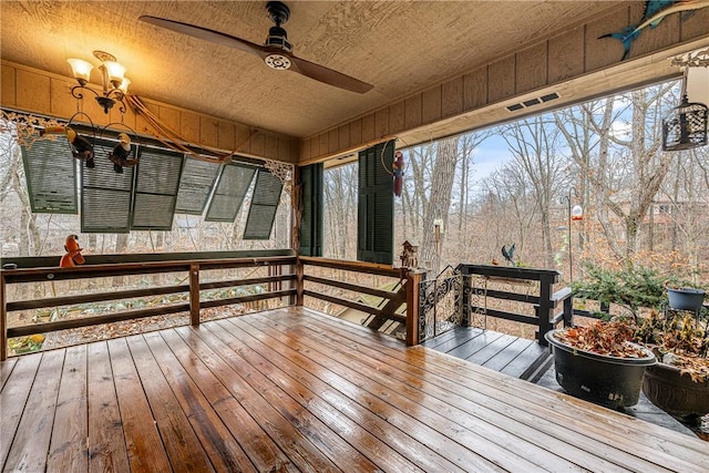 wooden deck featuring ceiling fan