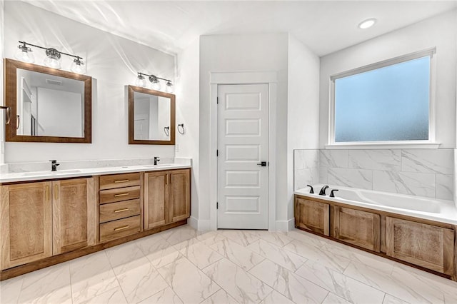 bathroom with a bathing tub and vanity