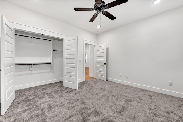 unfurnished bedroom featuring ceiling fan, carpet flooring, and a closet