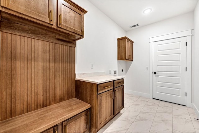 laundry room with cabinets and hookup for an electric dryer