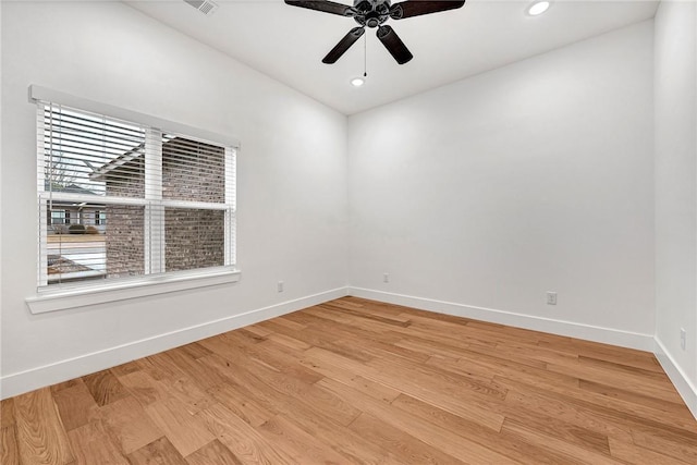 empty room with light hardwood / wood-style floors and ceiling fan