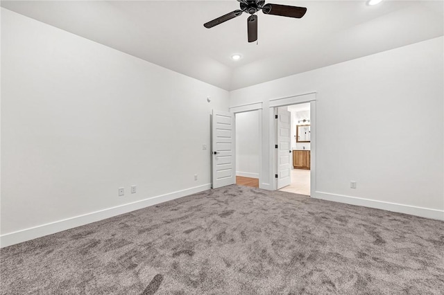 unfurnished bedroom featuring ceiling fan, connected bathroom, and light carpet