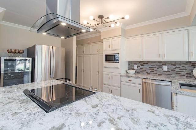 kitchen featuring island range hood, white cabinets, wine cooler, ornamental molding, and stainless steel appliances