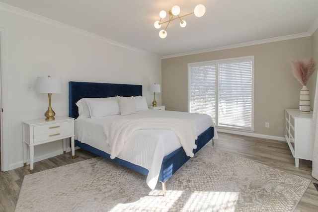 bedroom with crown molding and light wood-type flooring