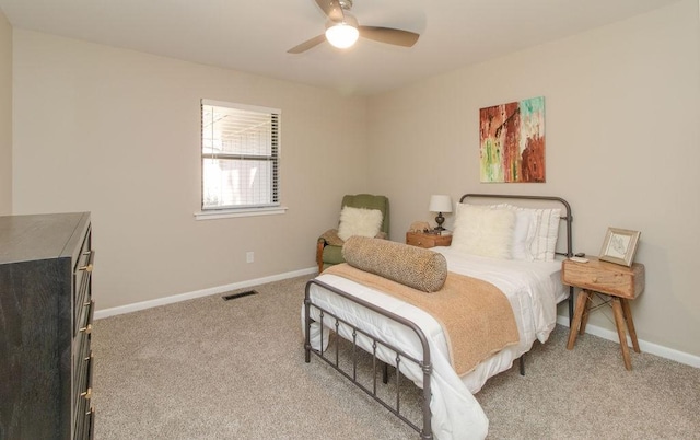 bedroom featuring light carpet and ceiling fan