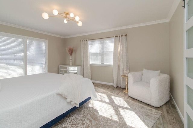 bedroom featuring crown molding and light hardwood / wood-style floors