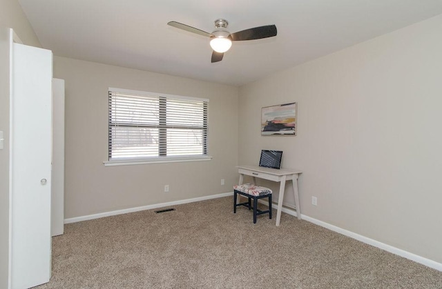 unfurnished office with light colored carpet and ceiling fan