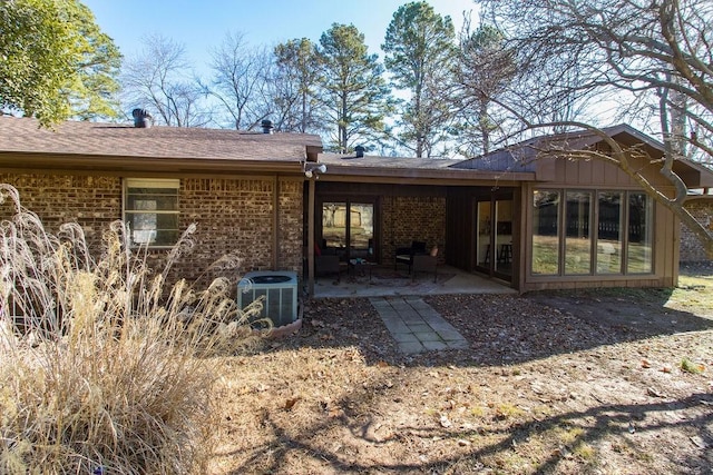 rear view of house featuring a patio and central AC