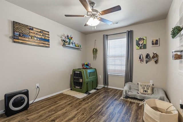 miscellaneous room featuring dark hardwood / wood-style floors and ceiling fan