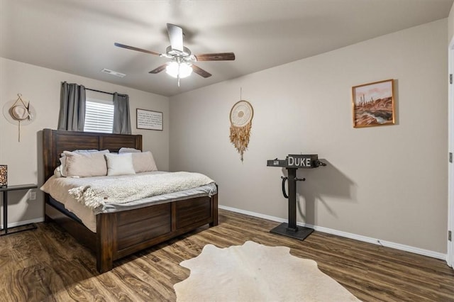 bedroom with ceiling fan and dark hardwood / wood-style flooring