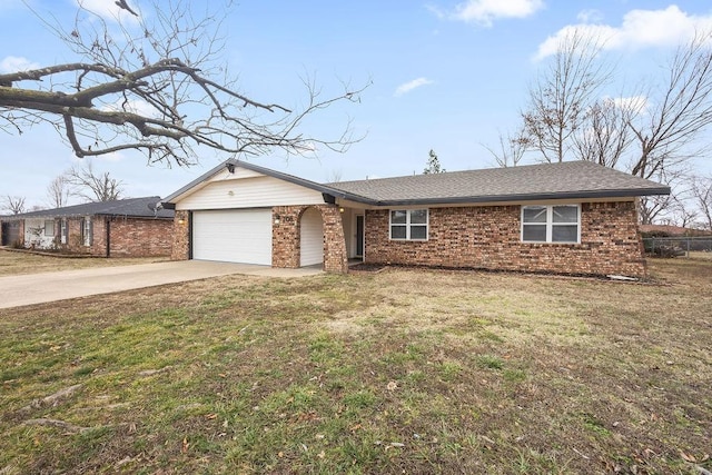 single story home featuring a garage and a front lawn