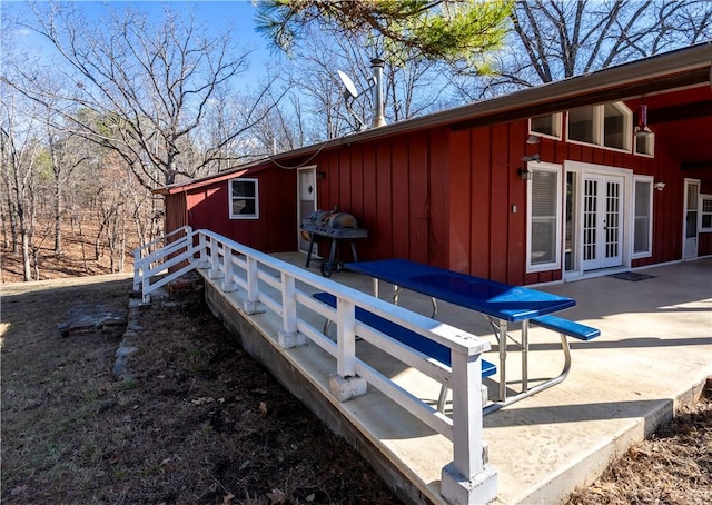 view of side of property featuring french doors