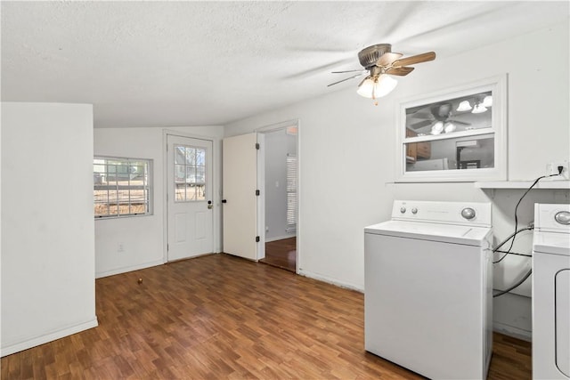 laundry room featuring washer / dryer, hardwood / wood-style floors, and a textured ceiling