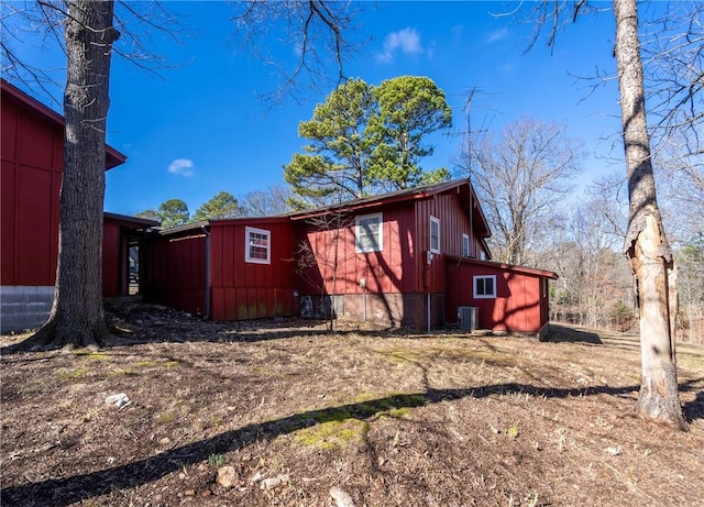 back of house featuring central air condition unit