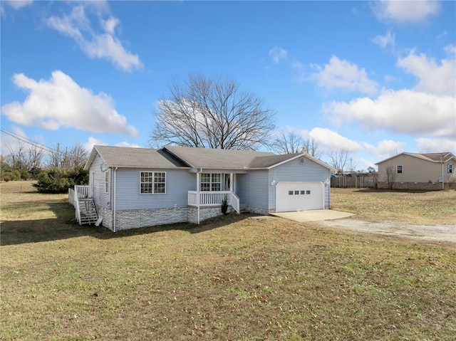 view of front of property featuring a garage and a front lawn