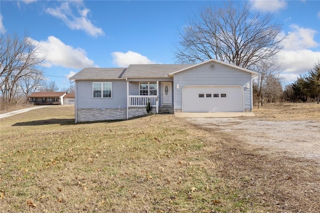 ranch-style home with a garage, a porch, and a front lawn