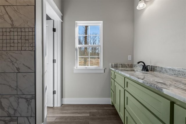 bathroom with vanity and hardwood / wood-style flooring