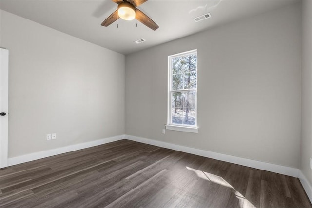 unfurnished room featuring ceiling fan and dark hardwood / wood-style flooring