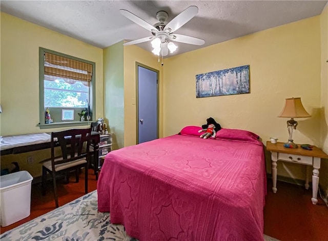 bedroom featuring hardwood / wood-style flooring and ceiling fan