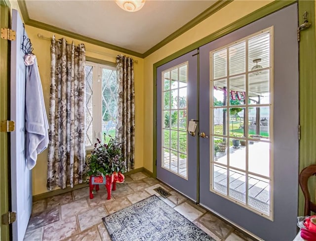 doorway featuring ornamental molding and french doors