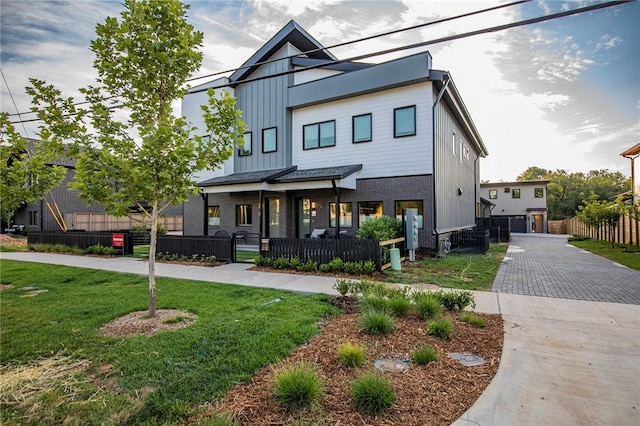 view of front of house with a front lawn and a porch