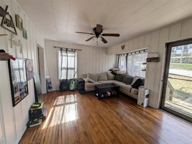 living room featuring hardwood / wood-style flooring and ceiling fan