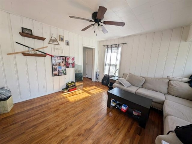 living room with ceiling fan and wood-type flooring