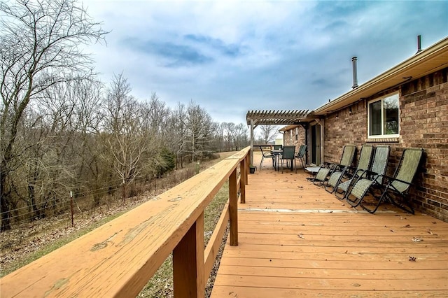 wooden deck featuring a pergola