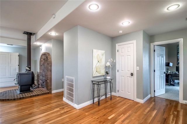 corridor featuring hardwood / wood-style floors