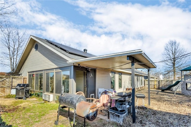 back of property with solar panels