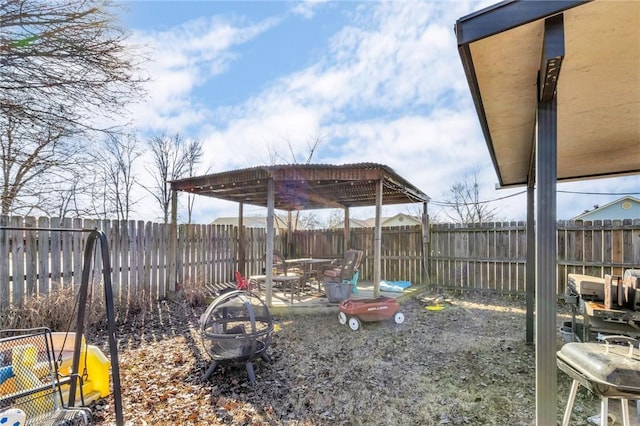 view of yard with an outdoor fire pit