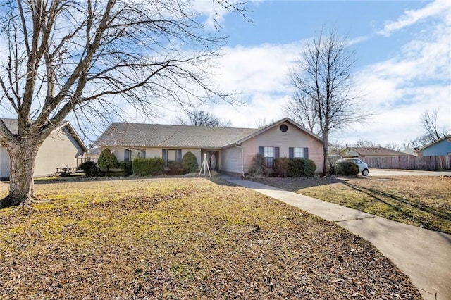 ranch-style house with a front yard